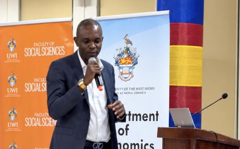 Professor Andre Haughton speaking at a UWI Department of Economics forum